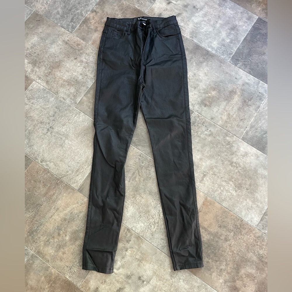 Black leather skinny jeans, never worn.